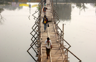 Crossing bamboo bridge