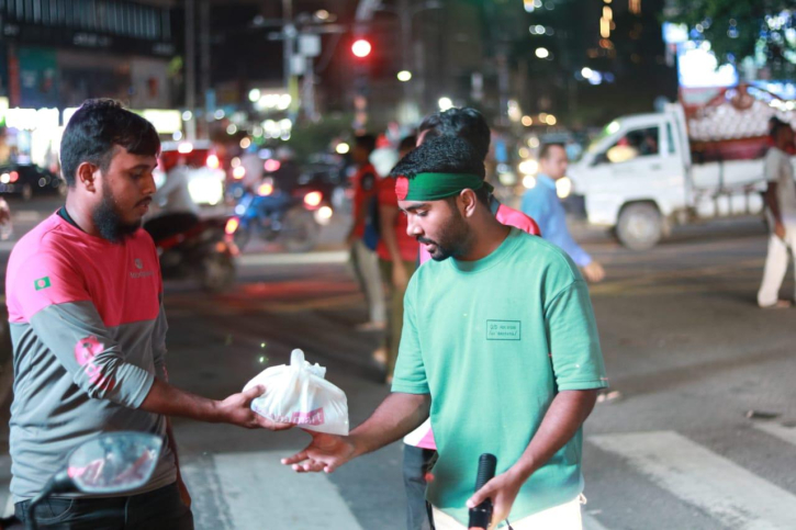 foodpanda Bangladesh distributes food among students managing traffic foodpanda Bangladesh distributes food among students managing traffic